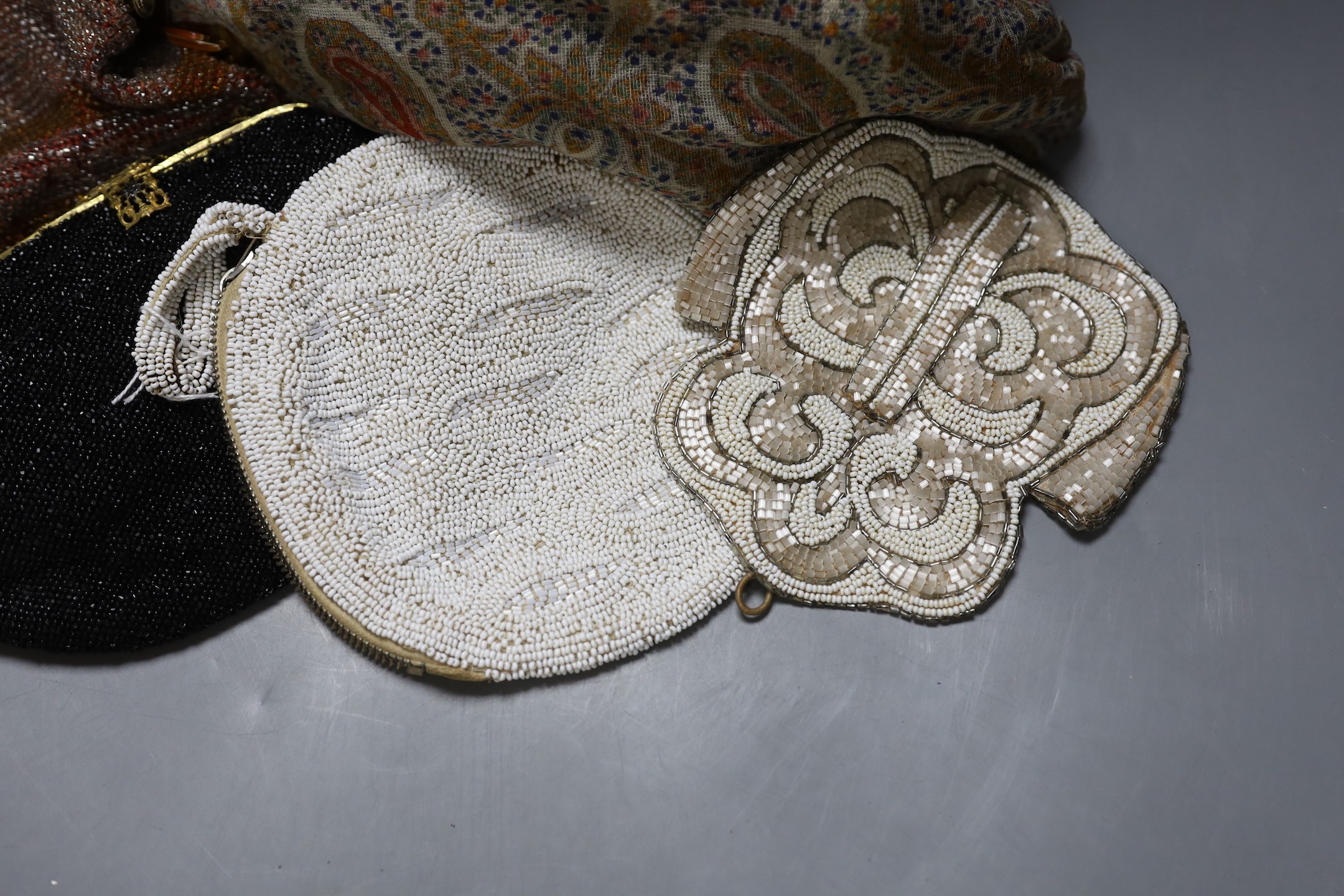 A paisley pattern silk shawl (damaged), together with four beaded evening bags